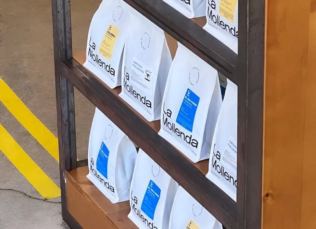 La Molienda coffee bags displayed on a shelf.