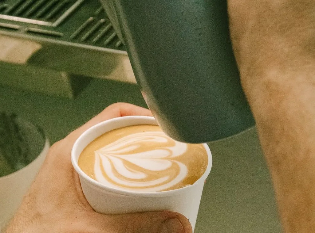 Latte art served in a La Molienda cup.